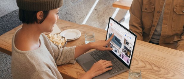 A Hubit designer working on a laptop